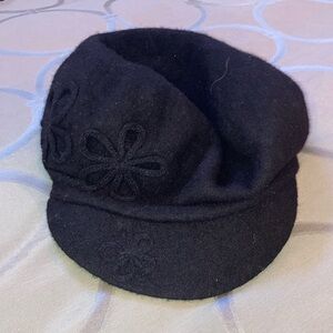 Women’s black hat. August.